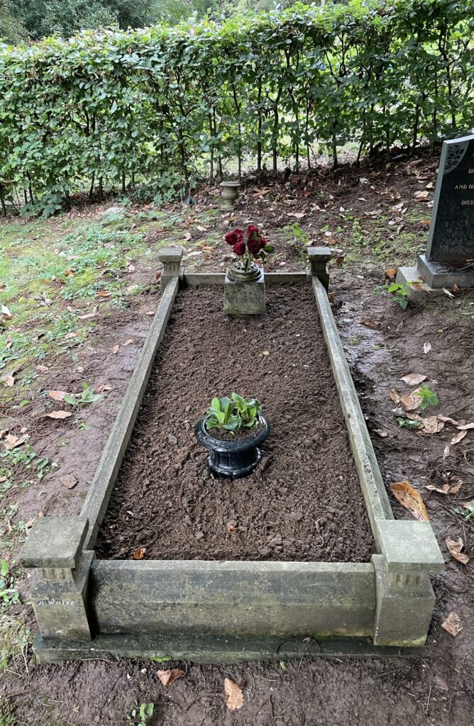 flower pots on a maintained grave