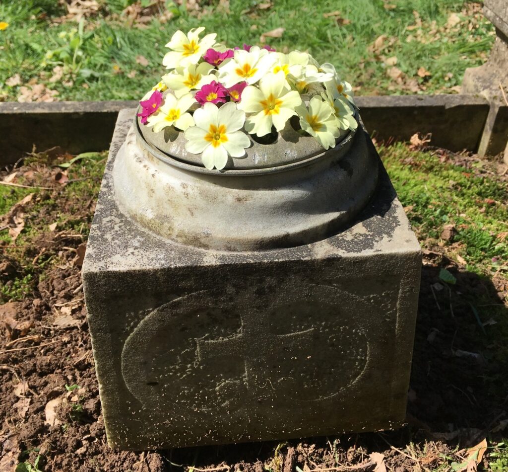 Flowers in an urn upon a grave