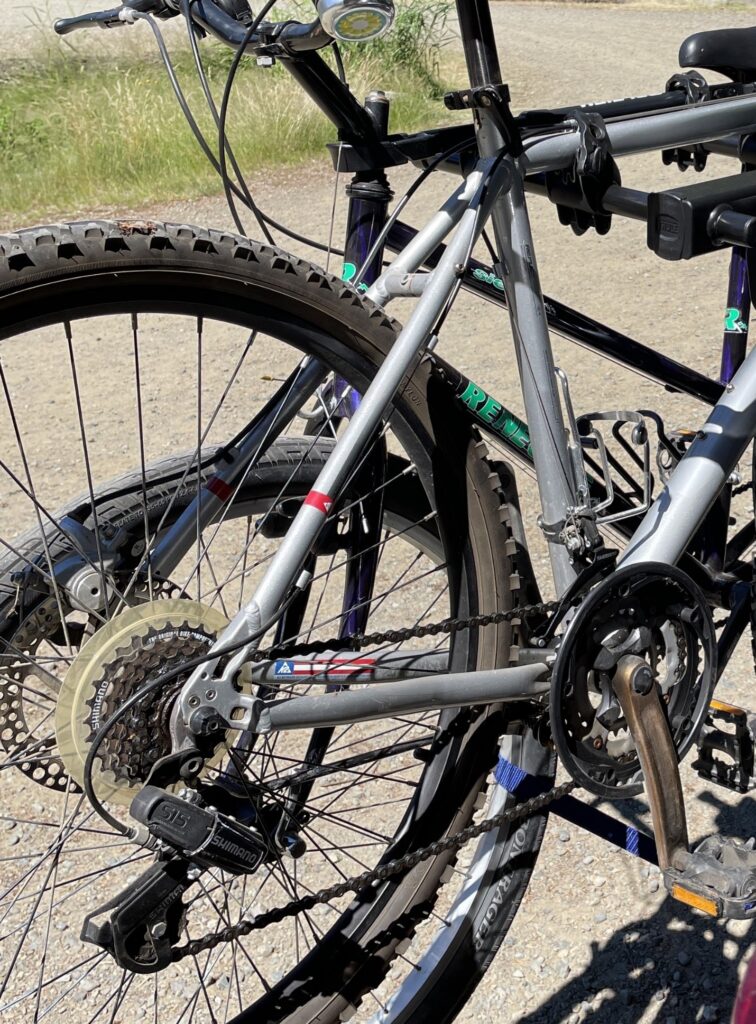 Bike strapped onto bike rack showing the different gears and the chain